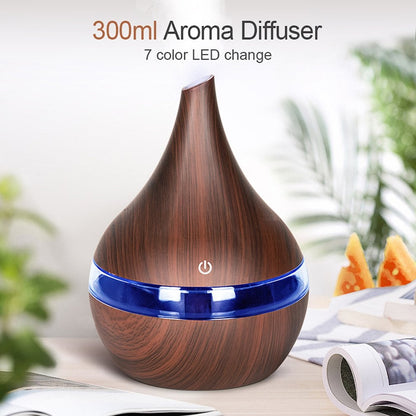 Wooden-patterned aroma diffuser with blue base on a blurred background